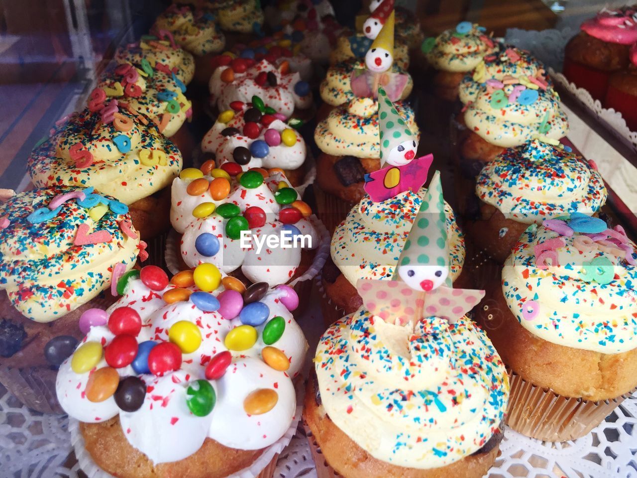 High angle view of fresh cupcakes on display at store