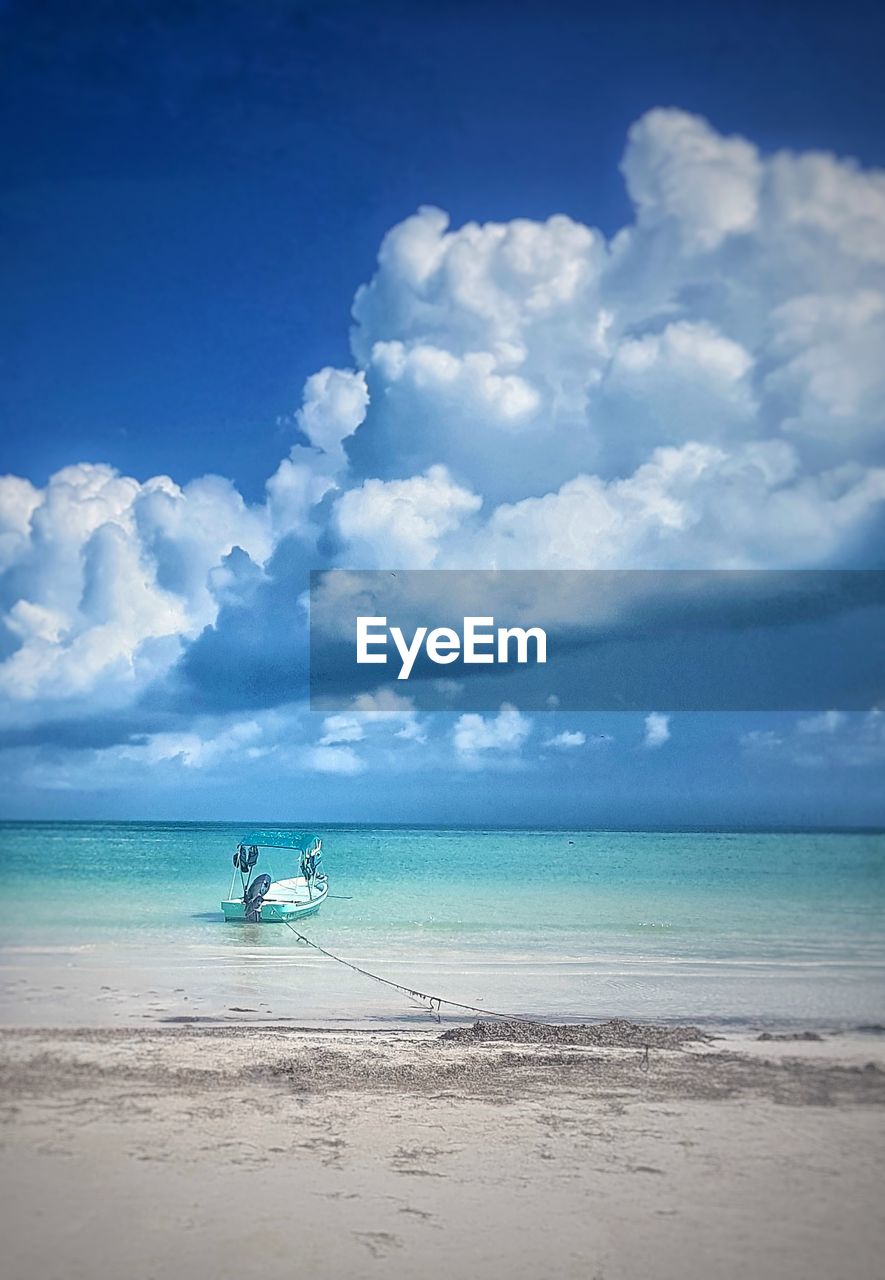 Holbox island - scenic view of sea against blue sky