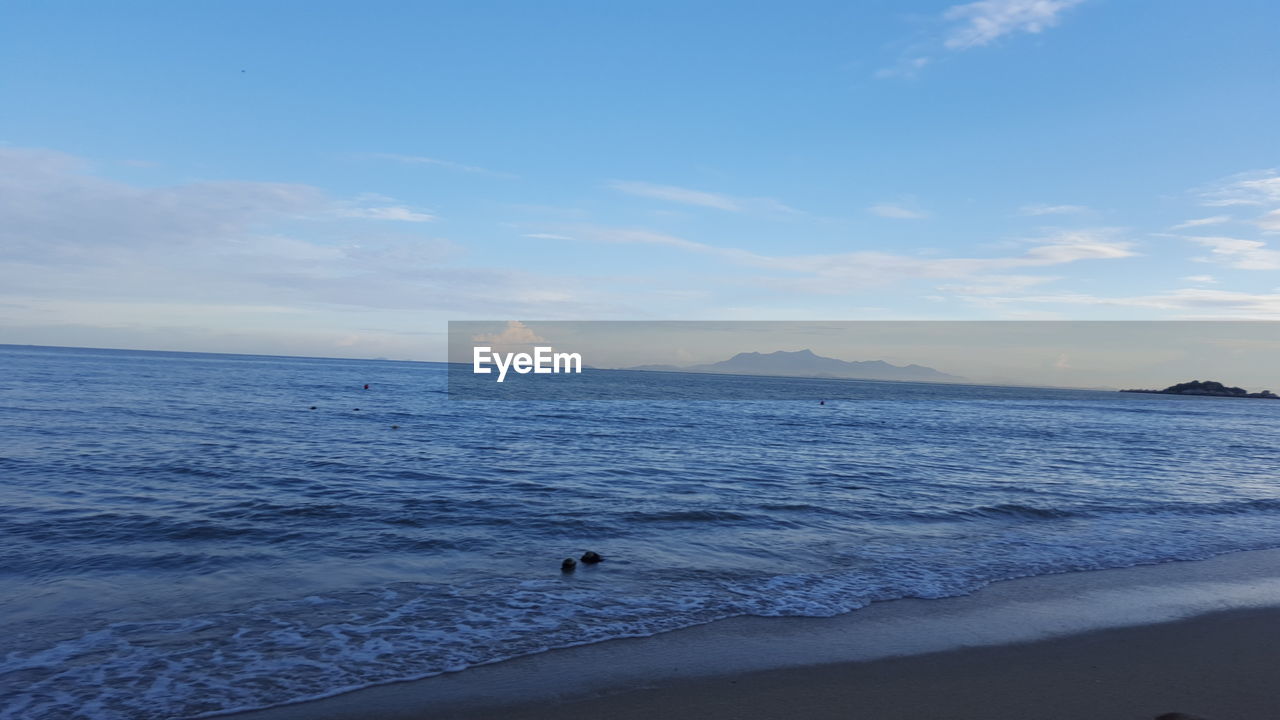 SCENIC VIEW OF SEA AGAINST SKY AT SUNSET