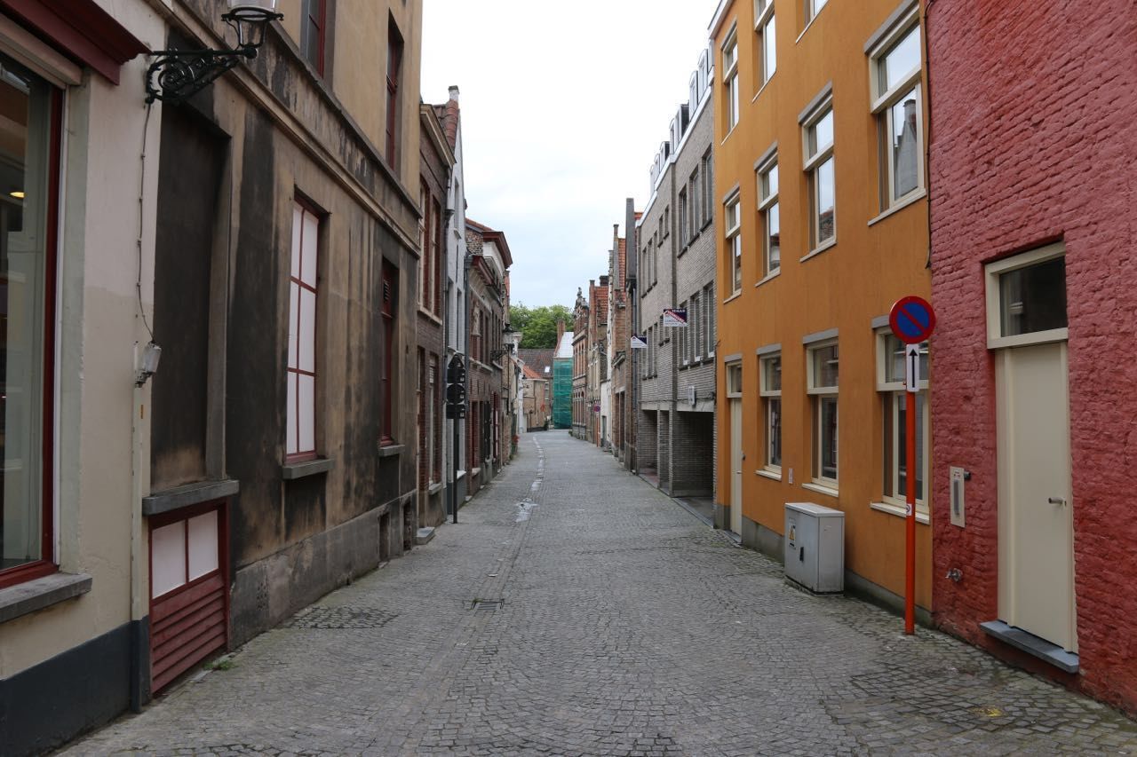 Empty alley amidst buildings