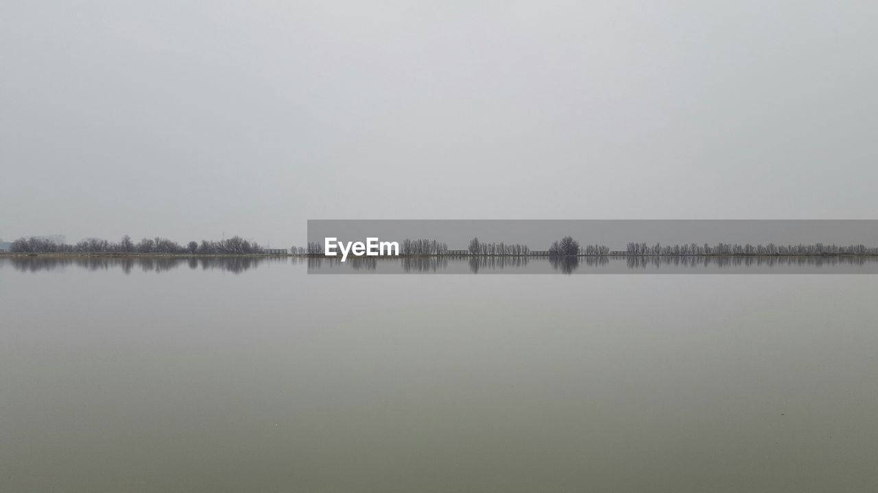 REFLECTION OF SKY ON LAKE