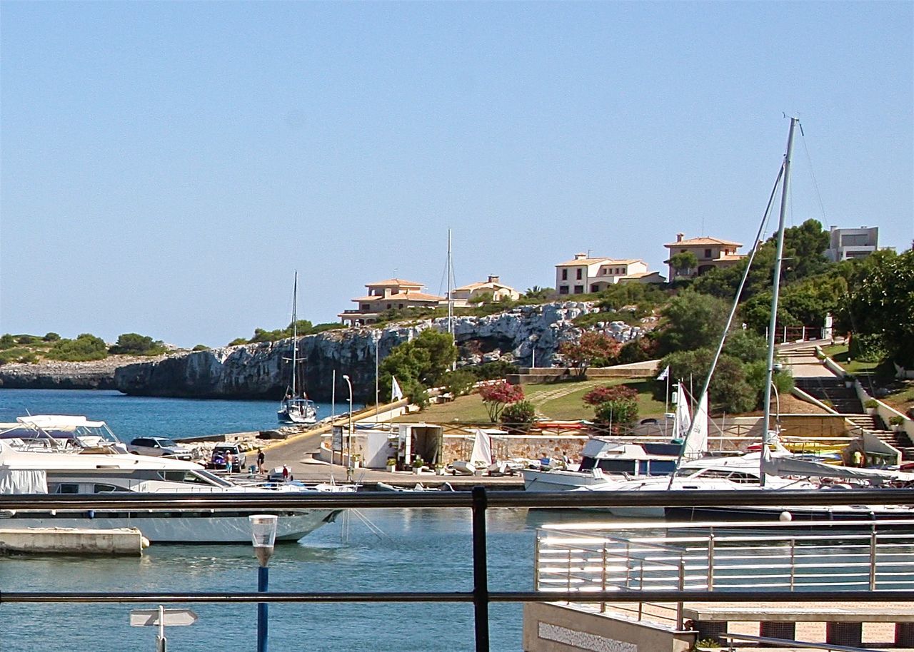 VIEW OF HARBOR AGAINST CLEAR SKY