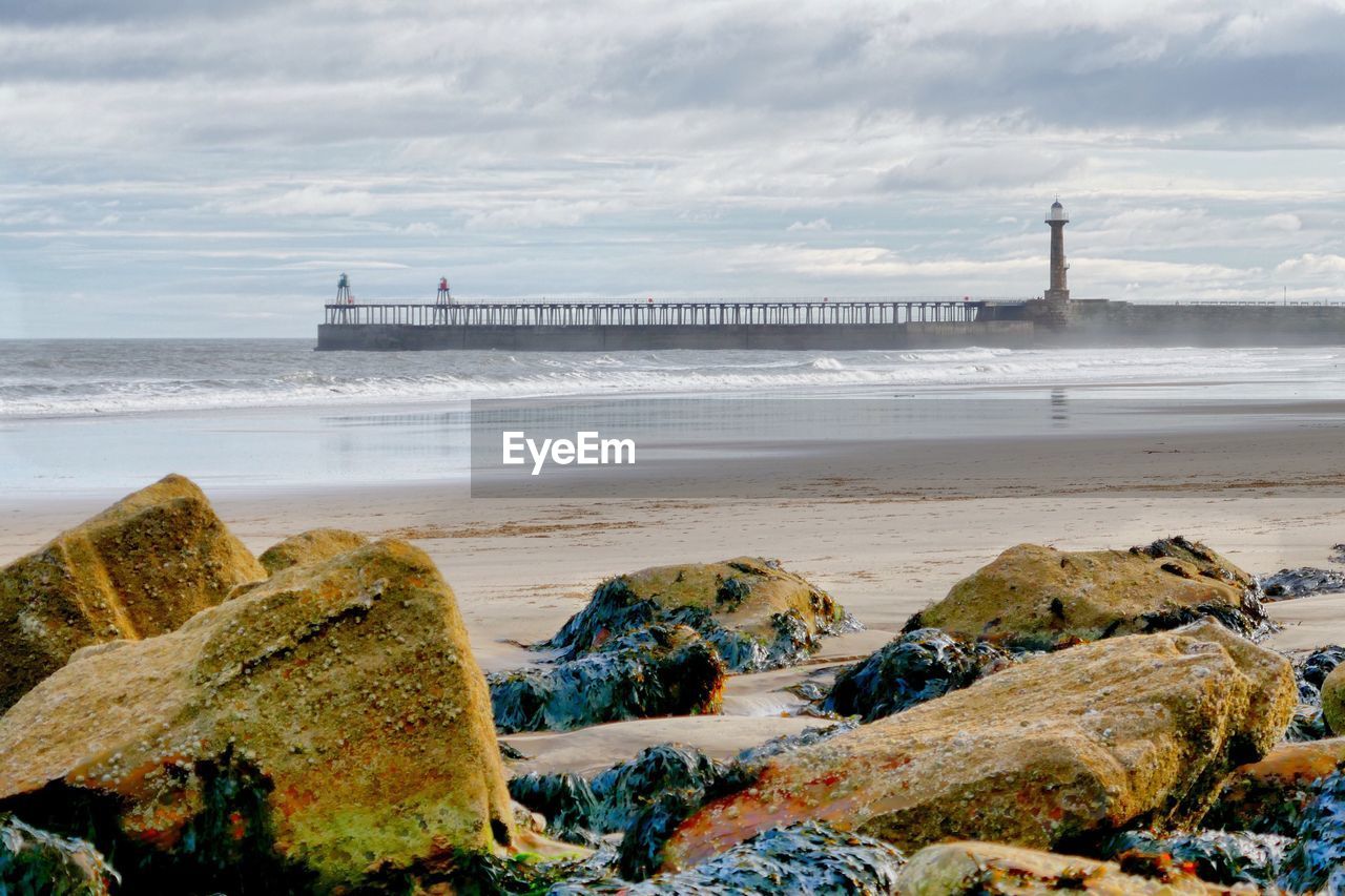 Scenic view of sea against cloudy sky