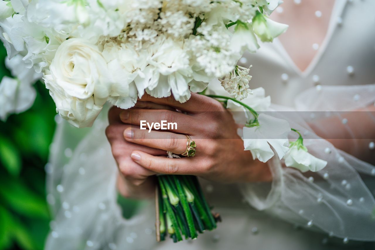 Close-up of hand holding bouquet