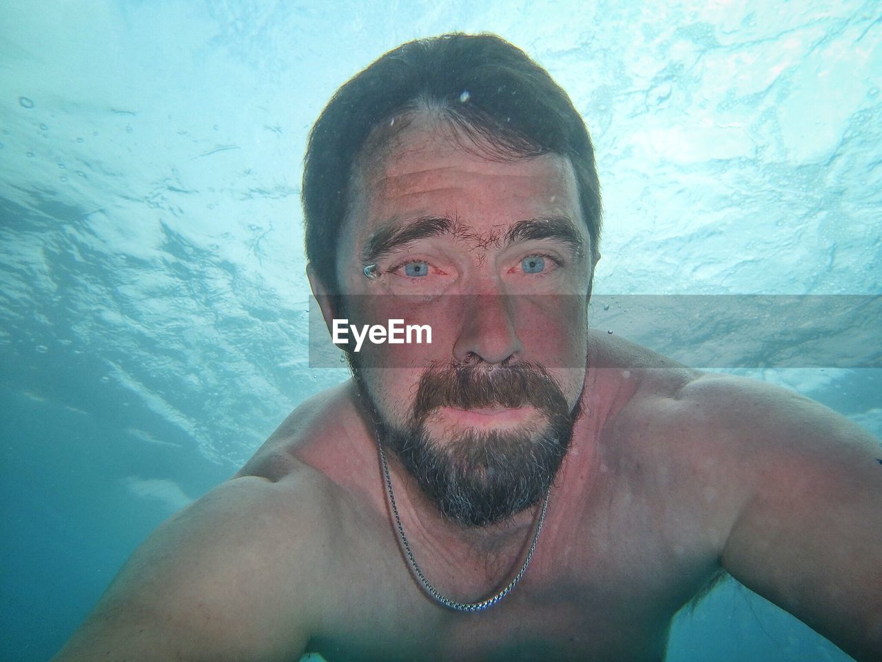 CLOSE-UP PORTRAIT OF SHIRTLESS MAN