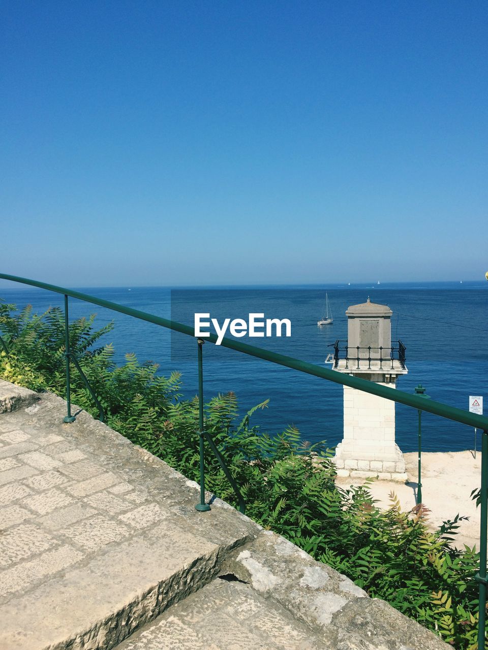 SCENIC VIEW OF SWIMMING POOL AGAINST CLEAR BLUE SKY