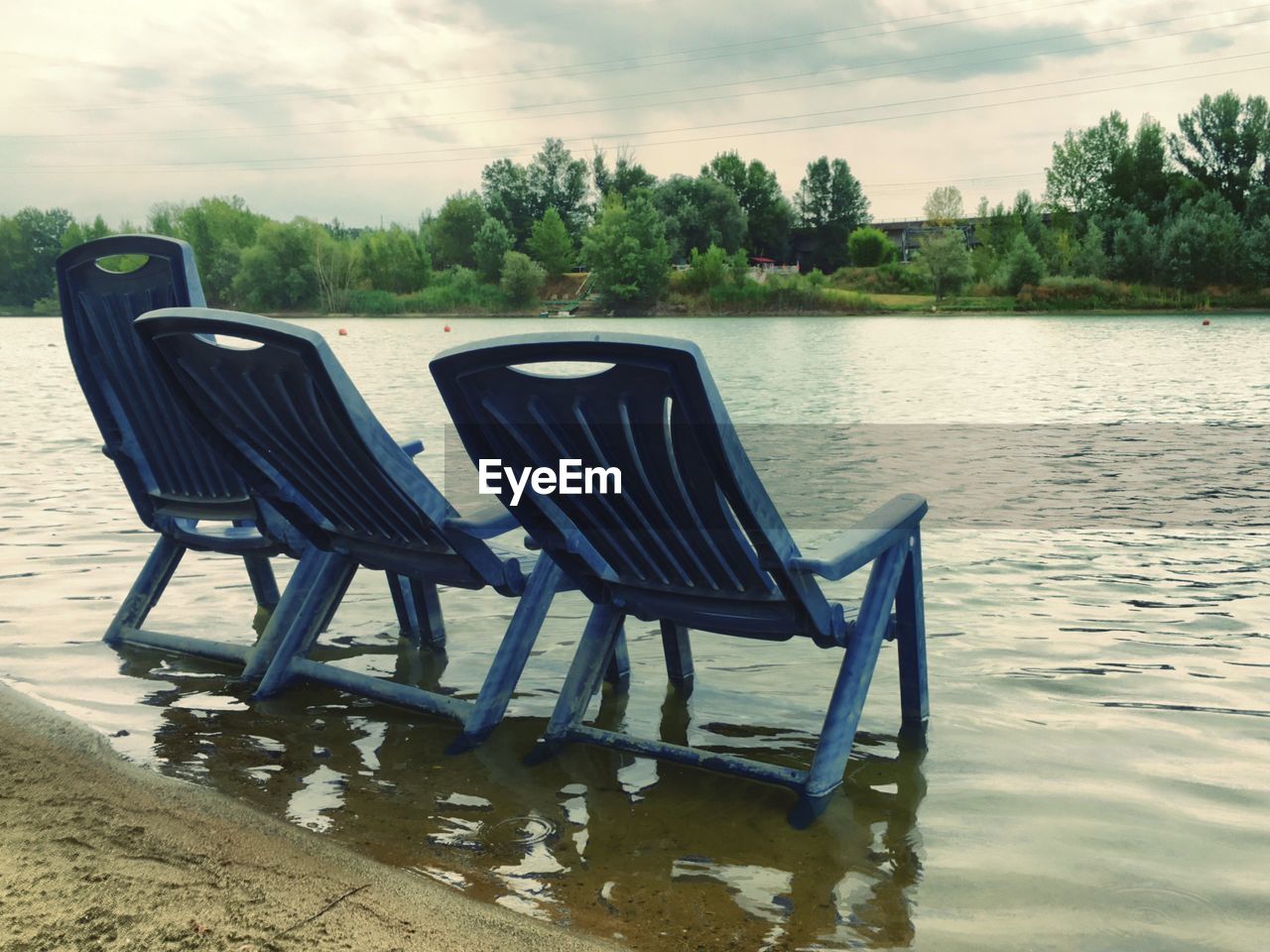 EMPTY BENCHES IN LAKE