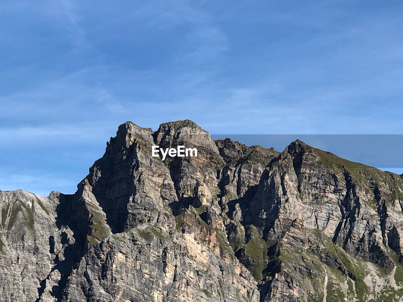 LOW ANGLE VIEW OF ROCK FORMATION AGAINST SKY