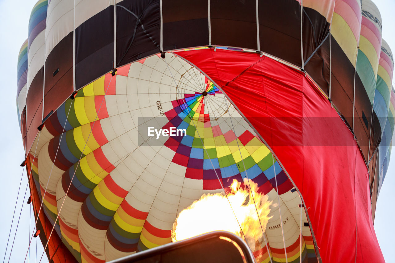 LOW ANGLE VIEW OF HOT AIR BALLOON FLYING