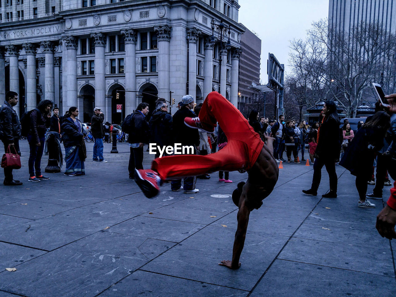 PEOPLE WALKING ON CITY STREET