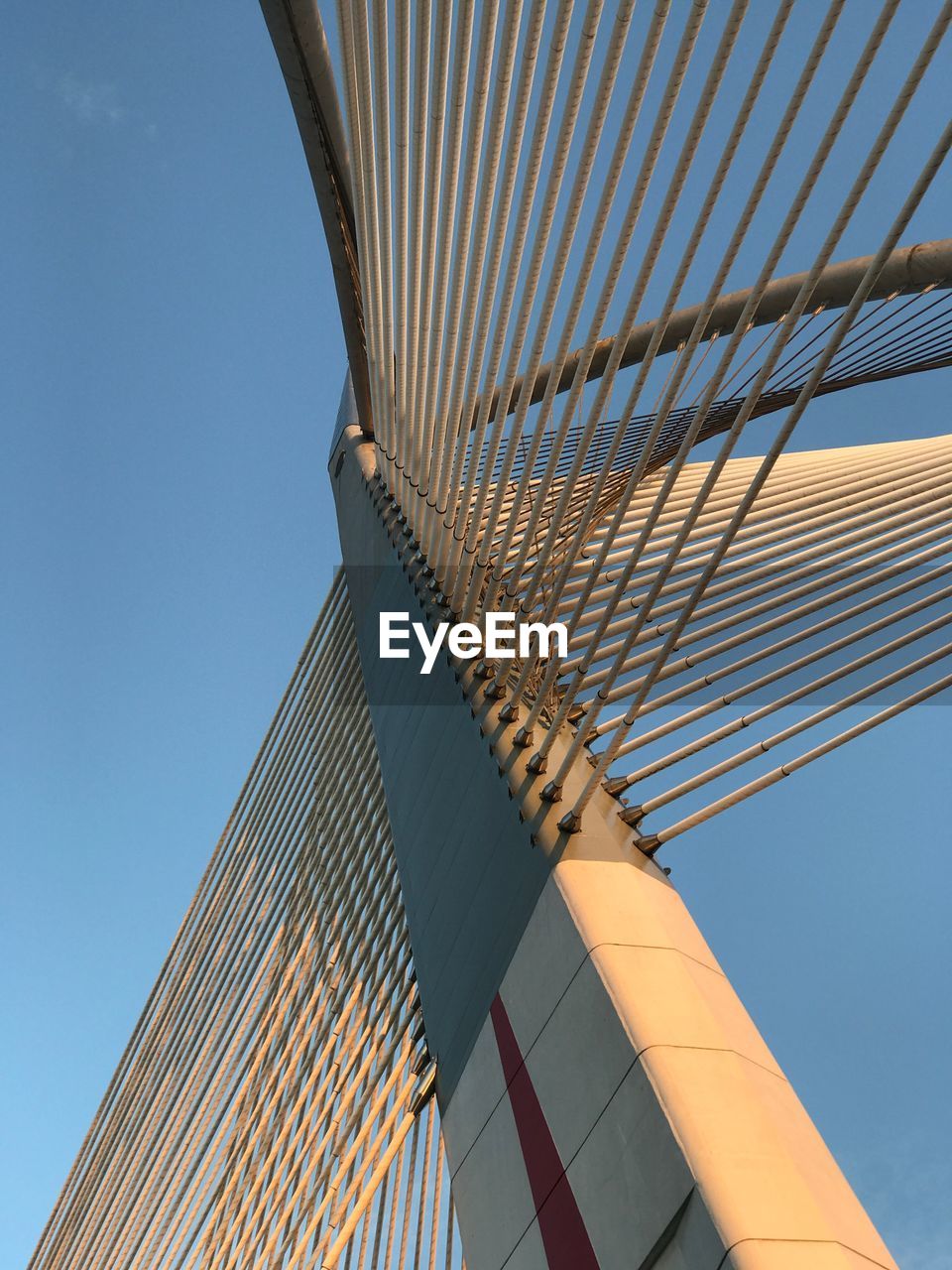 Low angle view of modern building against clear blue sky