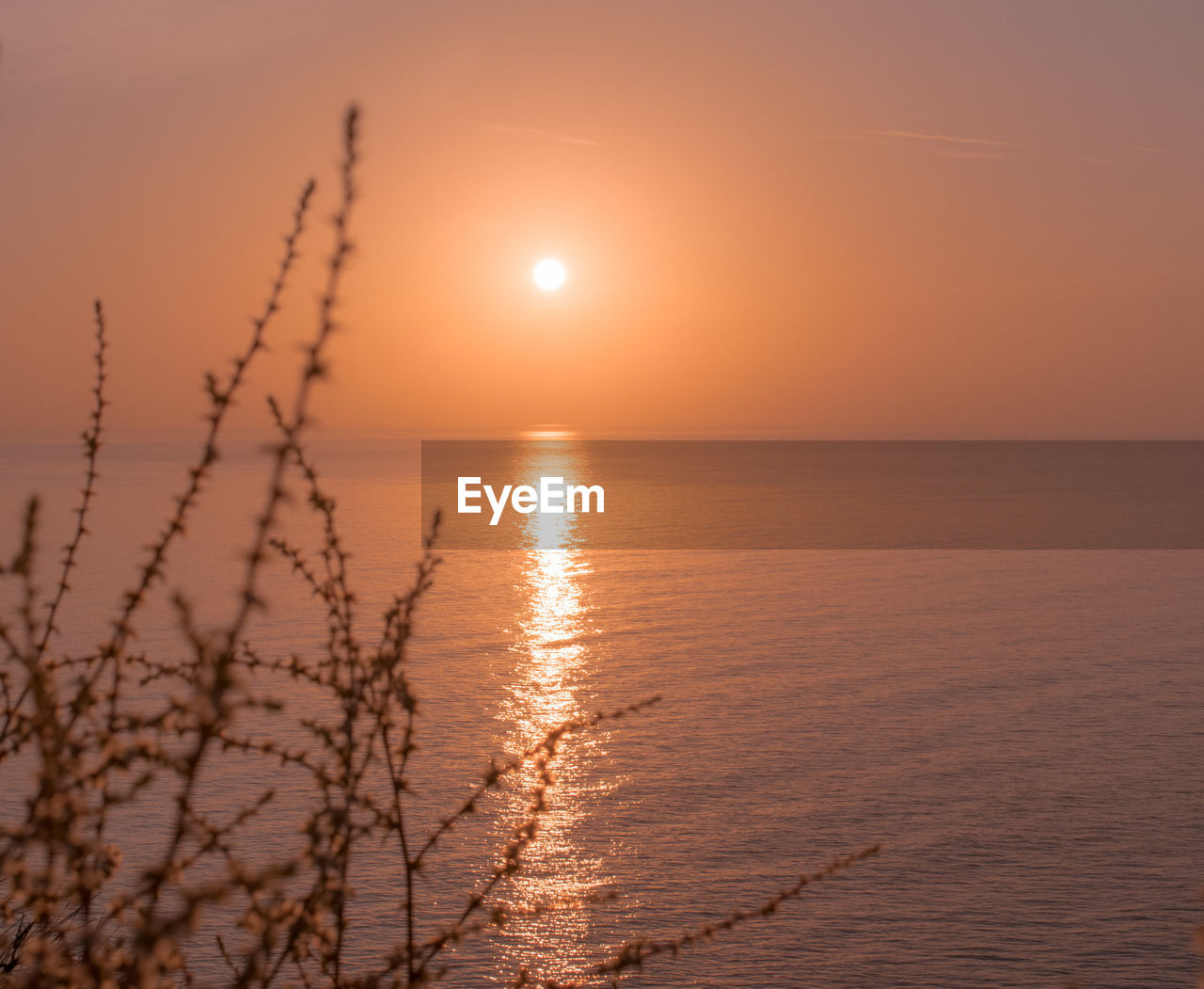 sunset, sky, water, sea, beauty in nature, scenics - nature, tranquility, nature, sun, horizon over water, tranquil scene, horizon, land, sunlight, reflection, environment, idyllic, beach, landscape, orange color, dramatic sky, dawn, no people, seascape, evening, urban skyline, outdoors, silhouette, cloud, atmospheric mood, twilight, travel destinations, non-urban scene, travel, afterglow, romantic sky, backgrounds, summer, holiday, vacation, awe, trip, moody sky, coastline, relaxation, back lit, gold, tourism, vibrant color