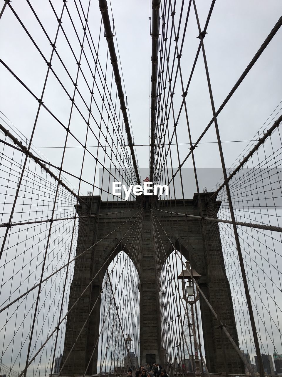 Low angle view of brooklyn bridge against sky