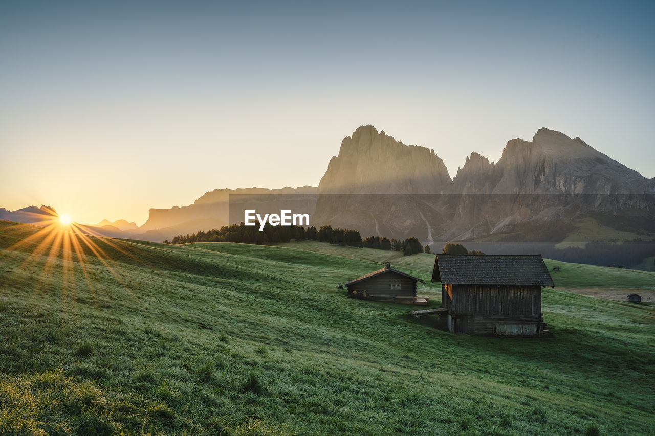 SCENIC VIEW OF SUNSET OVER MOUNTAINS