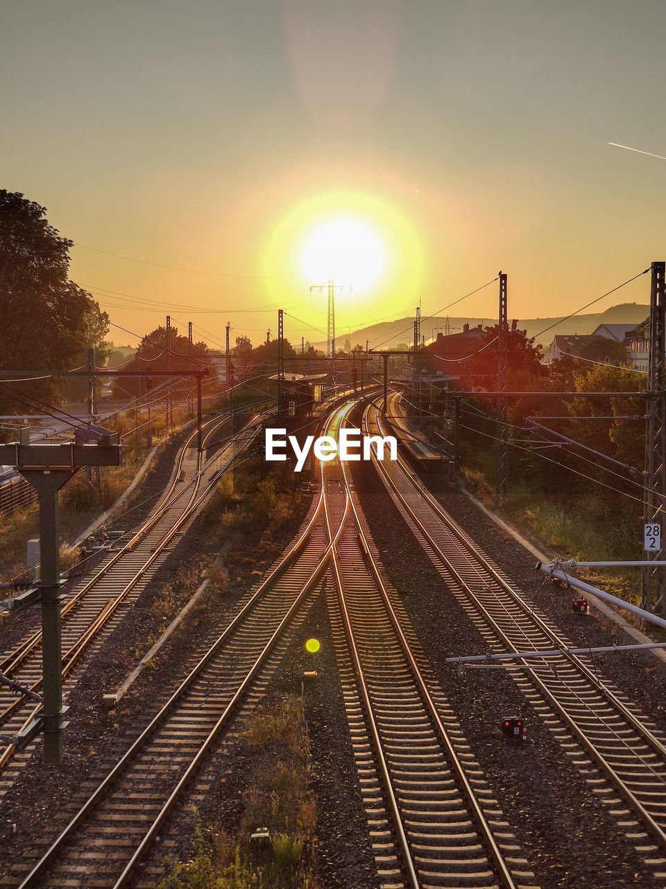 High angle view of railroad tracks against sky during sunset