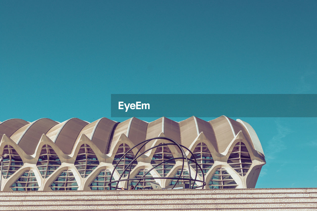 Modern building against clear blue sky