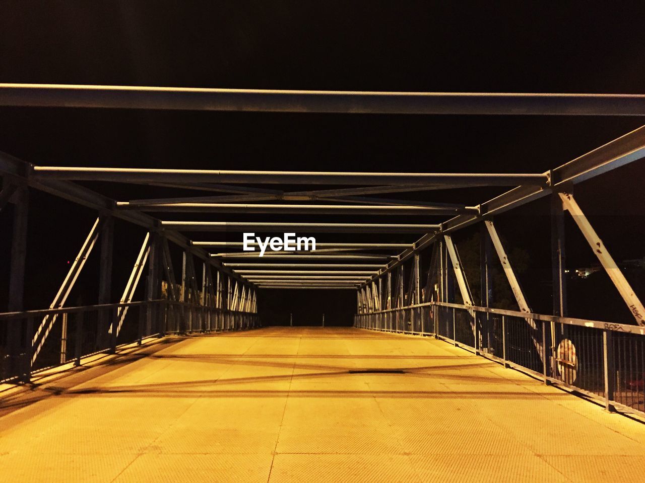 Illuminated bridge at night