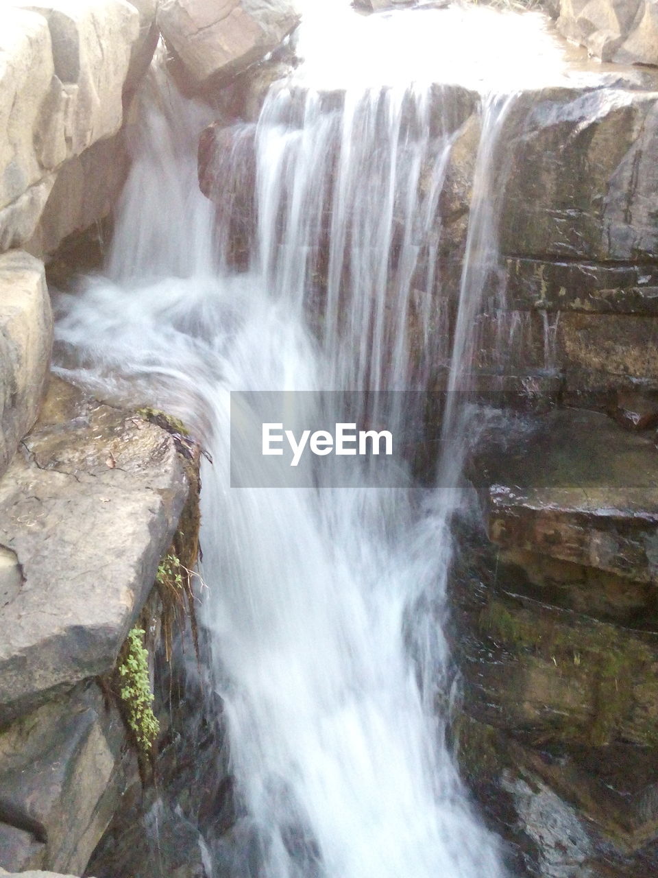 WATER FLOWING THROUGH ROCKS