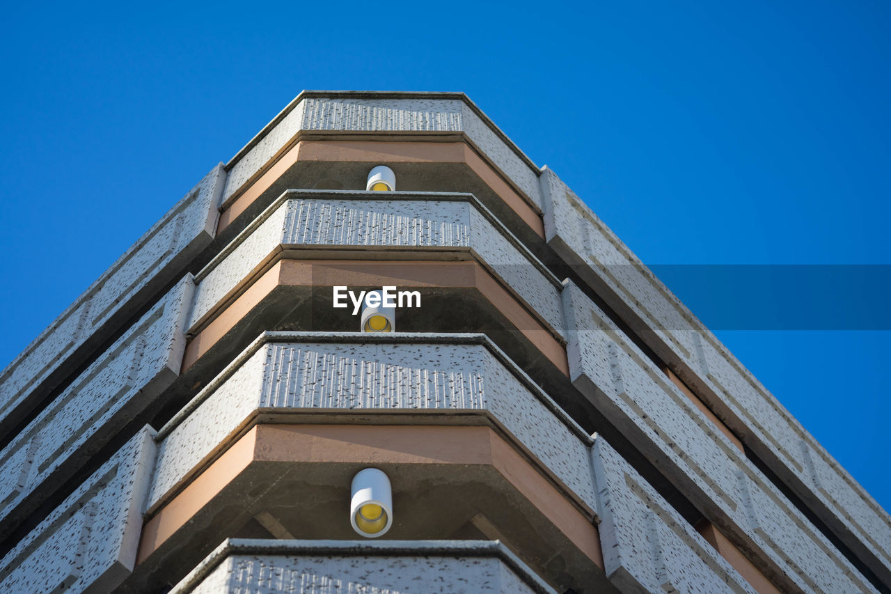 Low angle view of historic building against clear blue sky