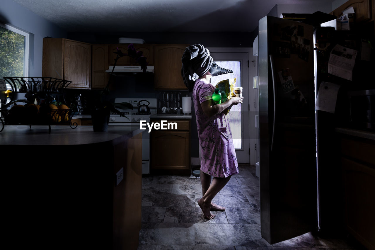 Woman standing at home