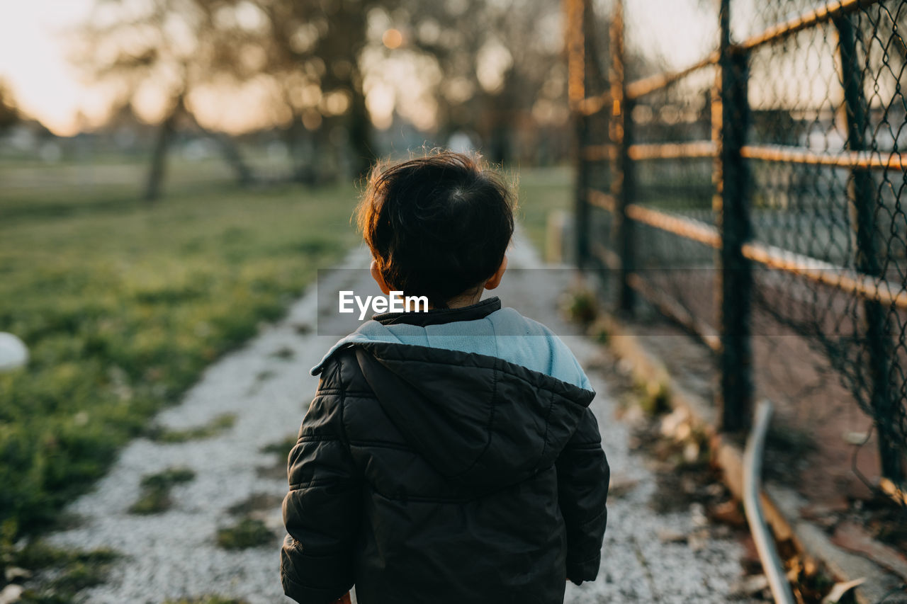 Rear view child with hooded jacket