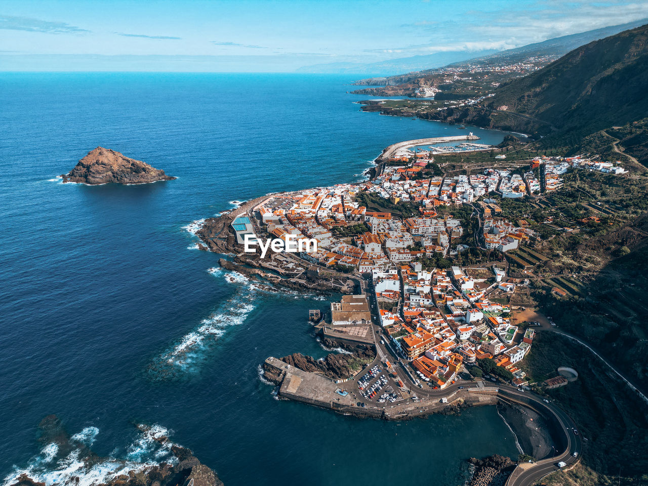 high angle view of townscape by sea