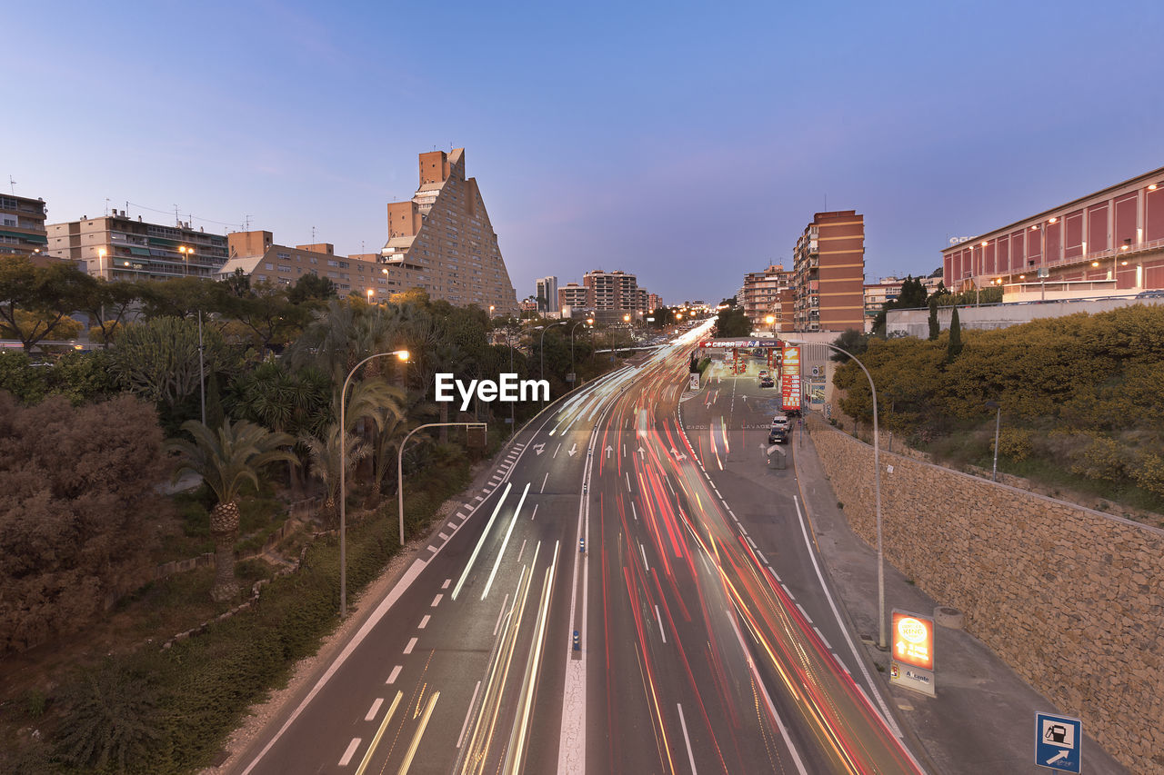 Long exposure dusk in a street with enough traffic in alicante.