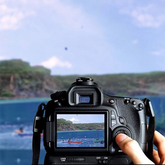 CROPPED IMAGE OF WOMAN HOLDING CAMERA