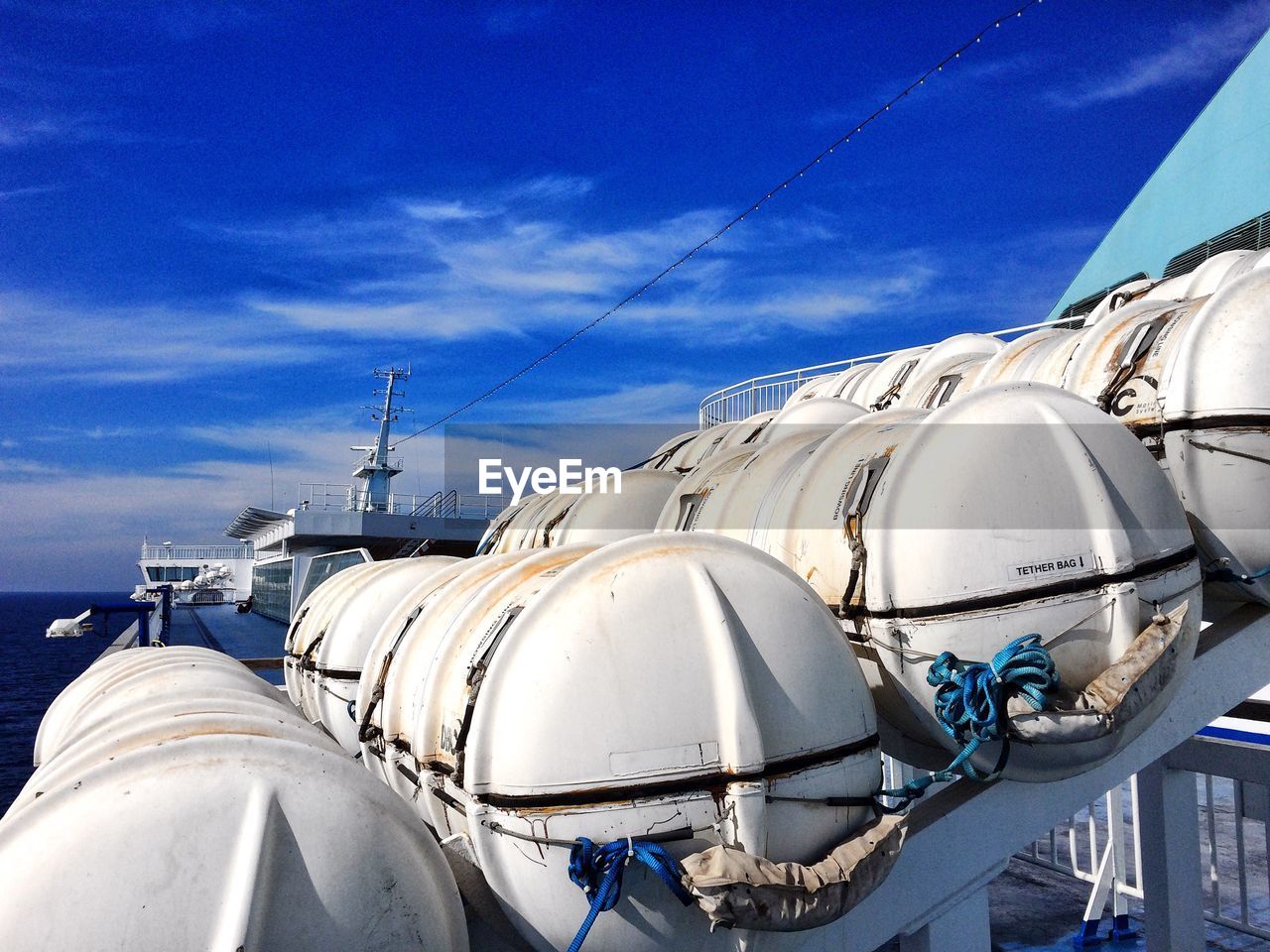 LOW ANGLE VIEW OF SMOKE STACKS AGAINST SKY