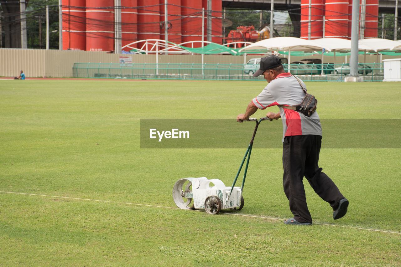 MAN AND DOG ON FIELD