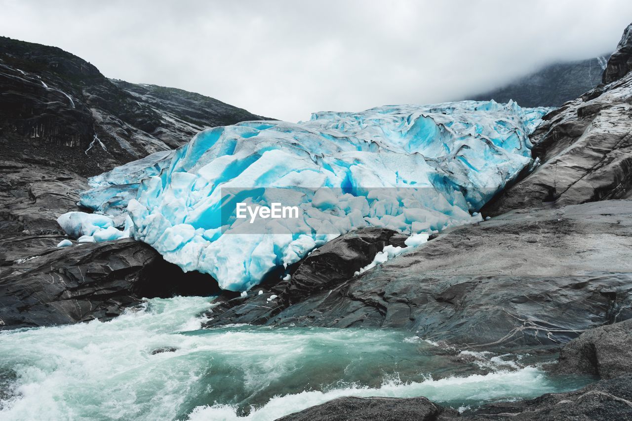 Scenic view of frozen lake against sky