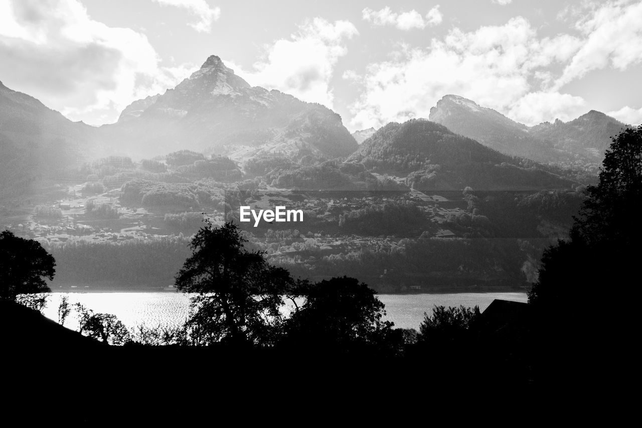 Scenic view of silhouette mountains against sky