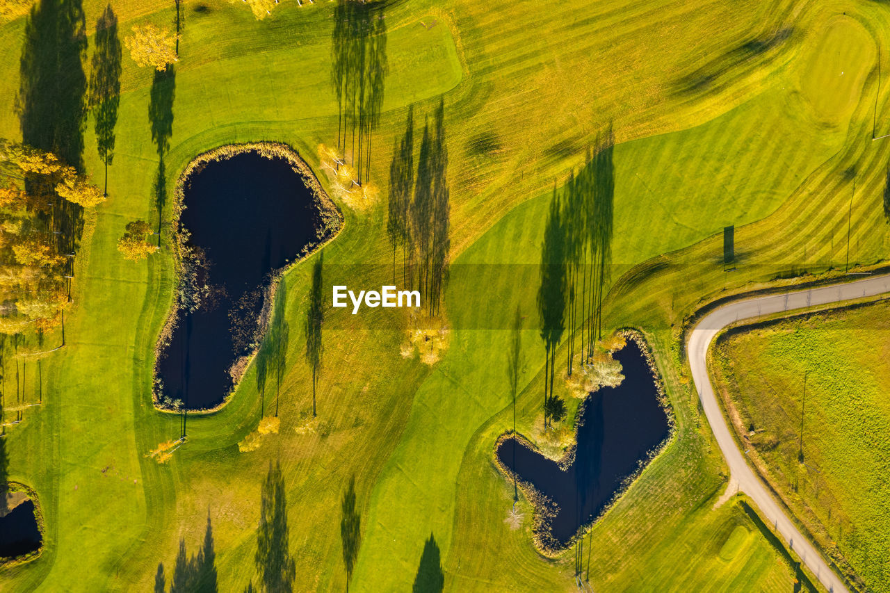 Aerial autumn fall sunny day view of golf course field