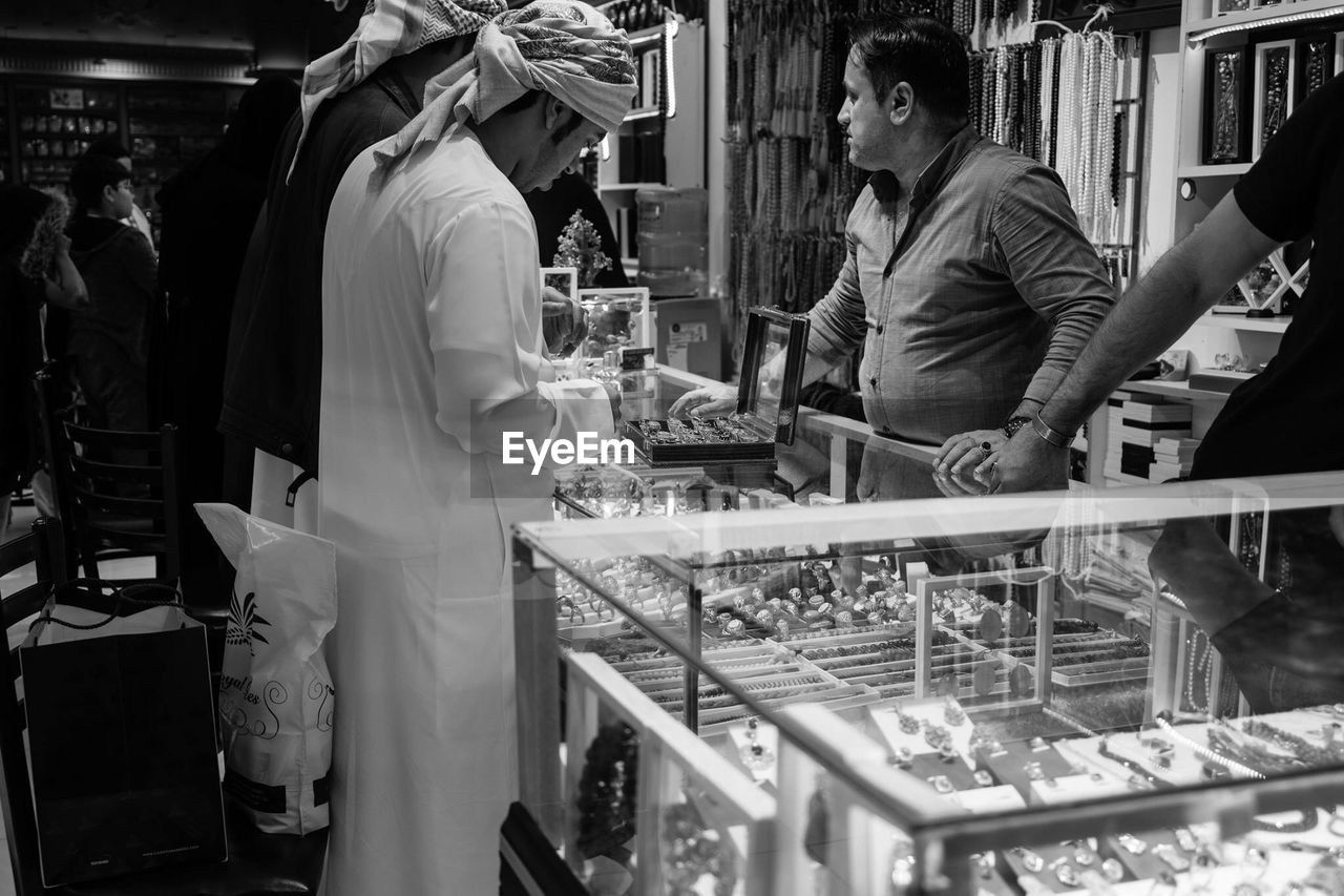 PANORAMIC VIEW OF PEOPLE IN SHOPPING MALL