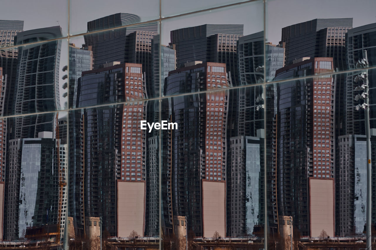 Low angle view of modern buildings against sky