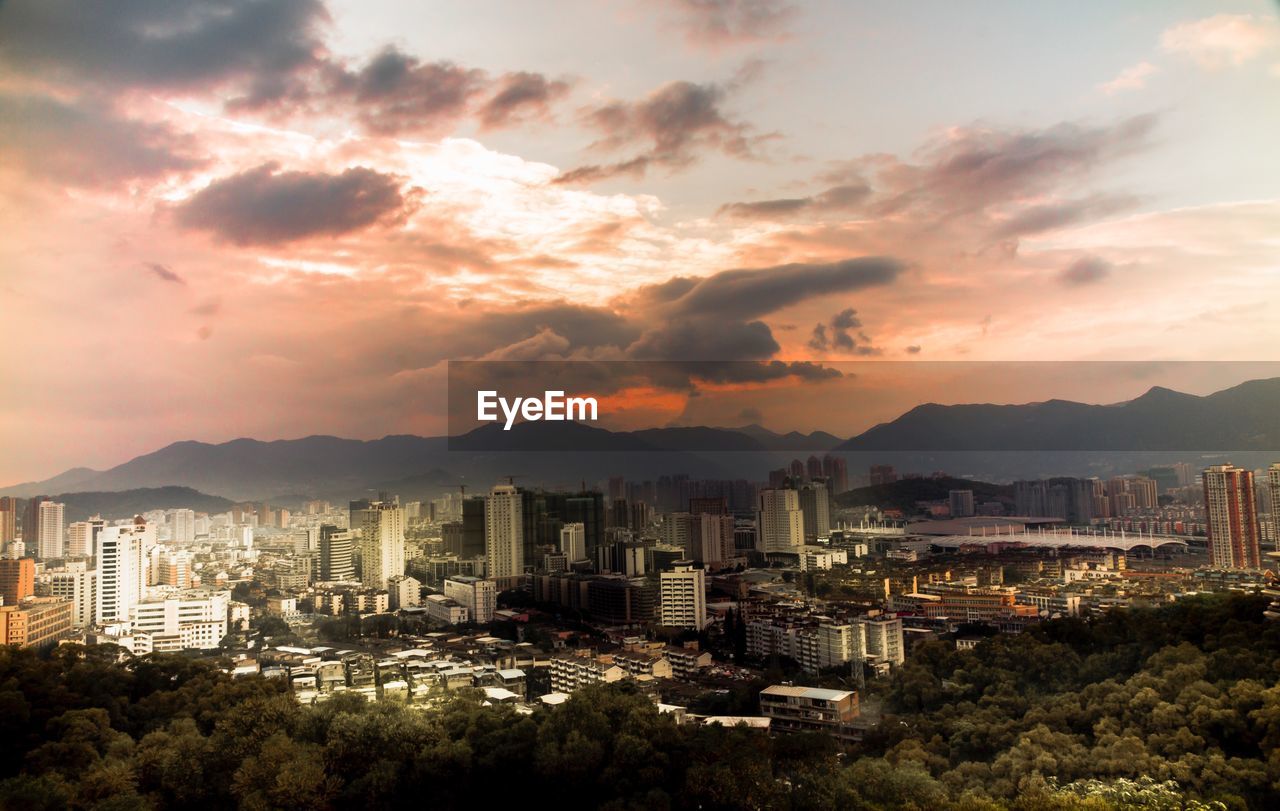 High angle view of city at sunset