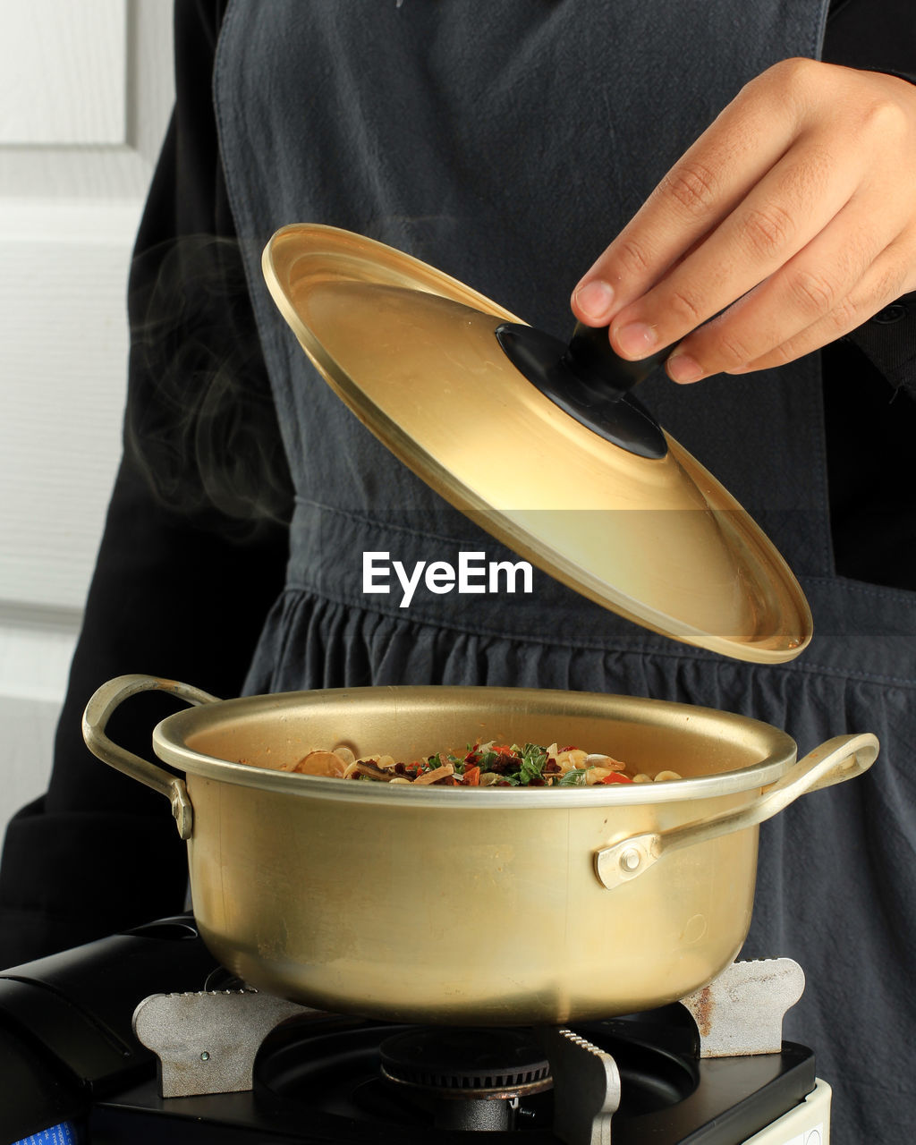 midsection of man preparing food on table