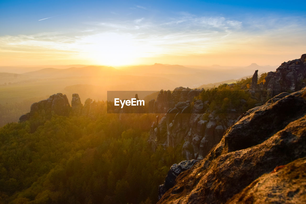 Scenic view of mountains against sky during sunset