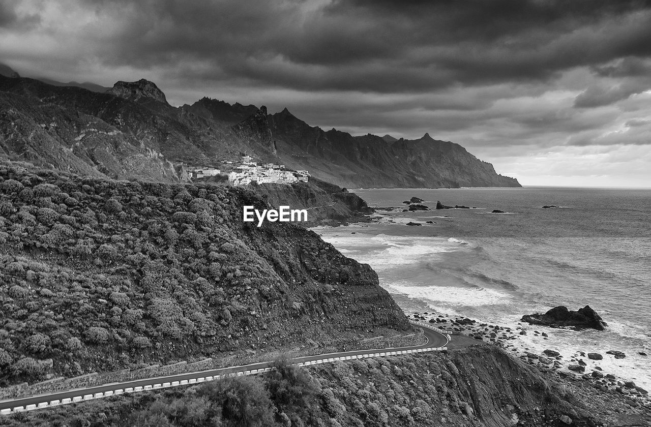 Scenic view of sea against cloudy sky