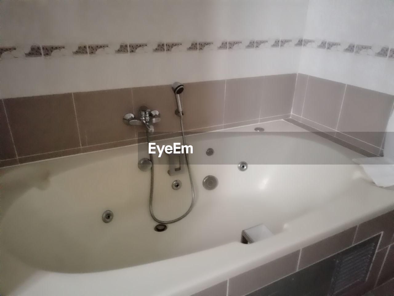 CLOSE-UP OF BATHROOM IN BATHTUB