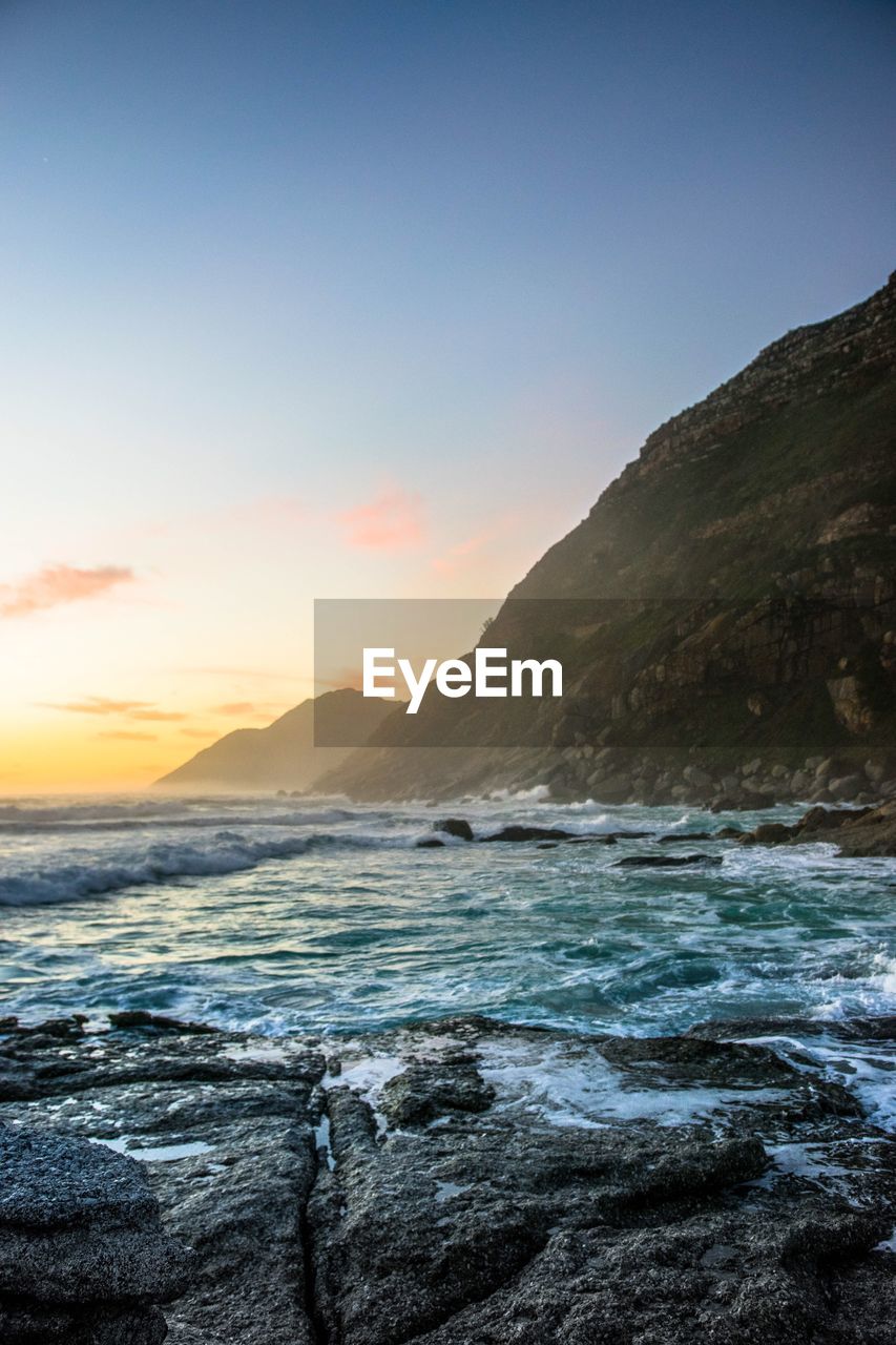 Scenic view of sea against sky during sunset