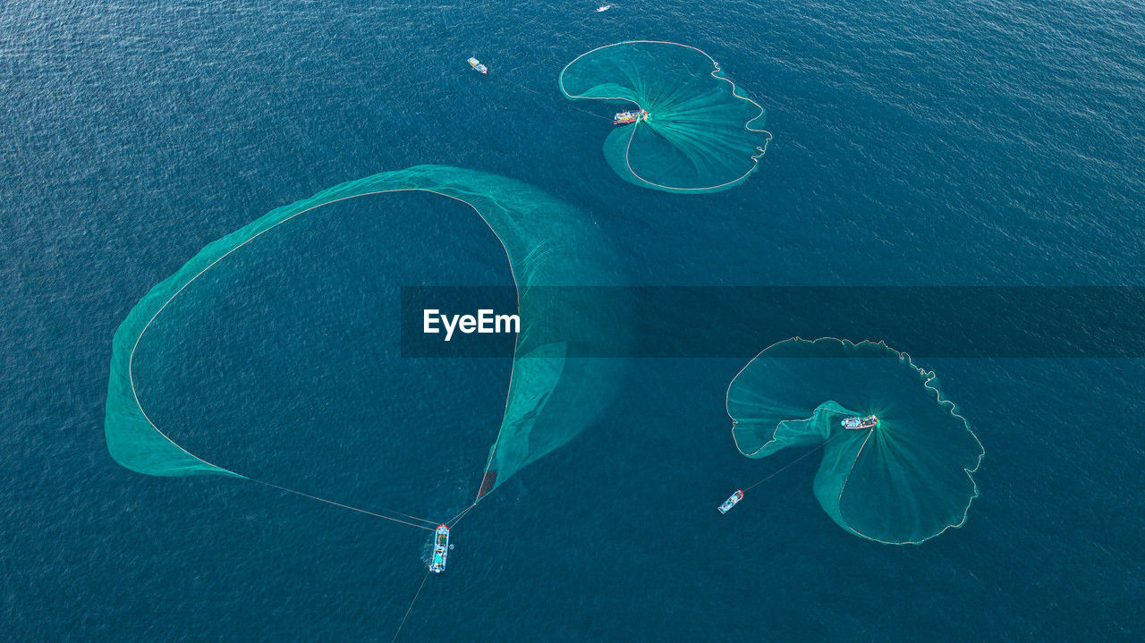 high angle view of person swimming in sea