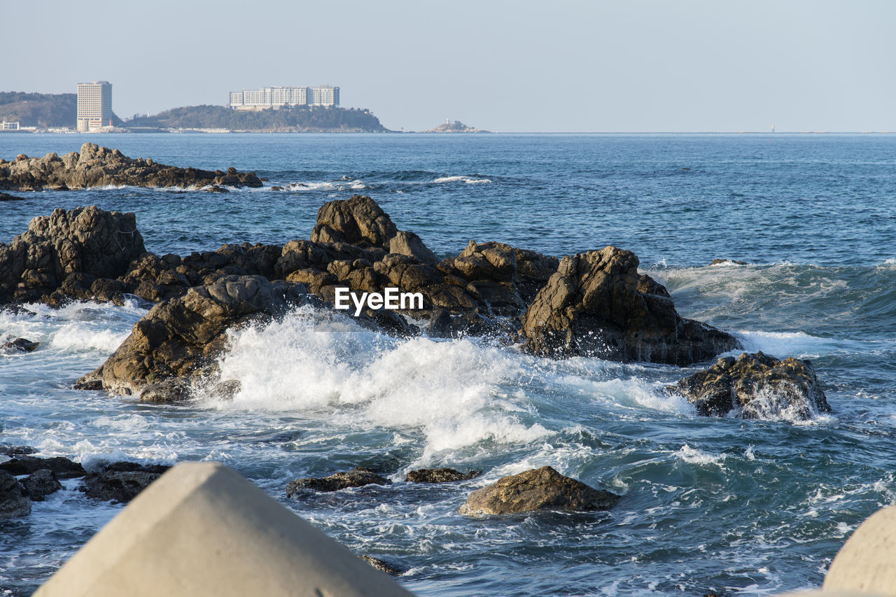 Sea waves splashing on rocks