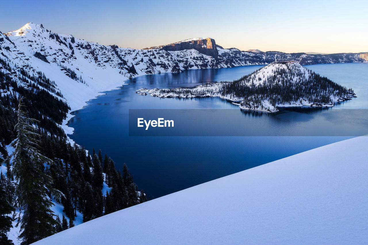 Winter at crater lake and wizard island during sunset