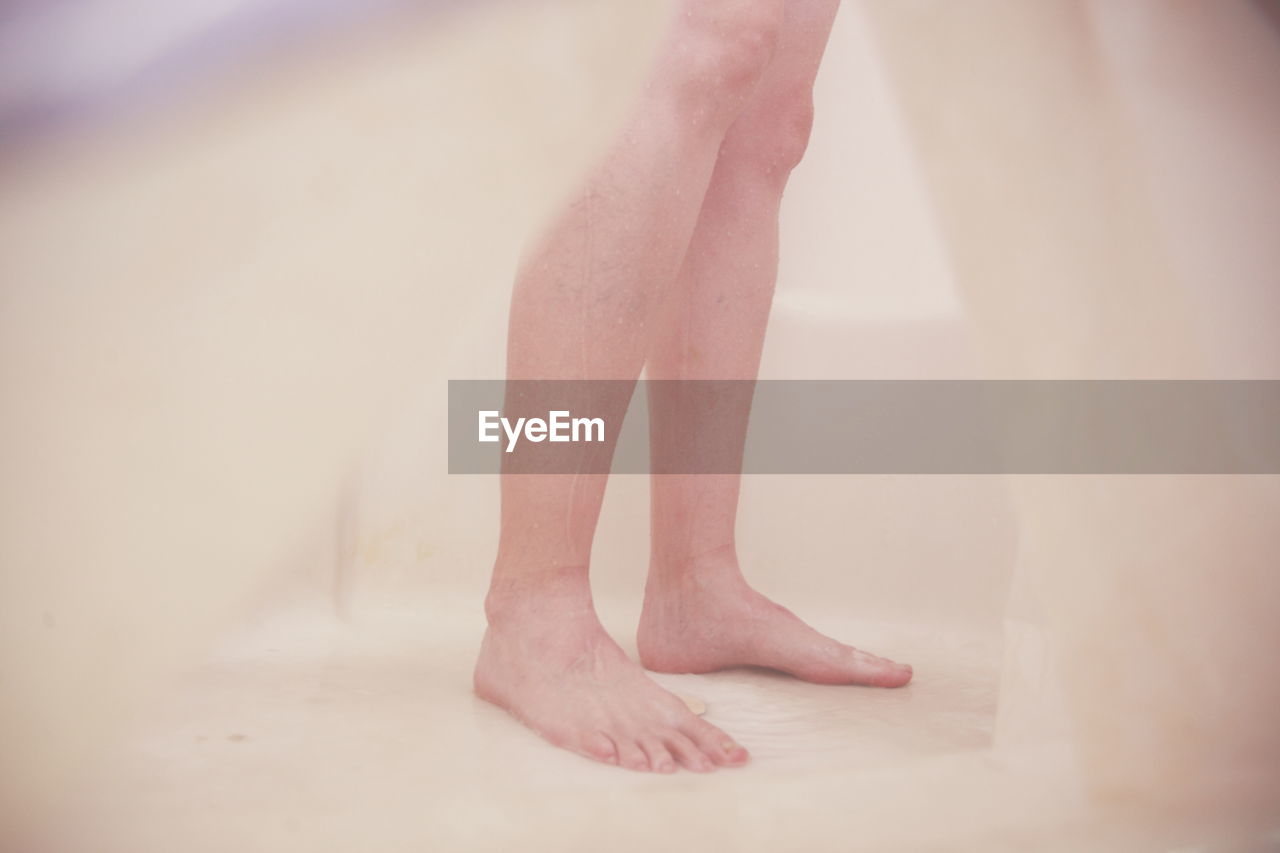 Low section of woman in bathroom