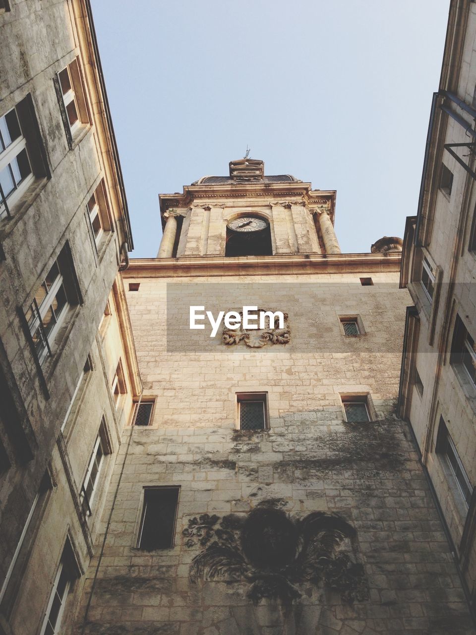 LOW ANGLE VIEW OF CLOCK TOWER