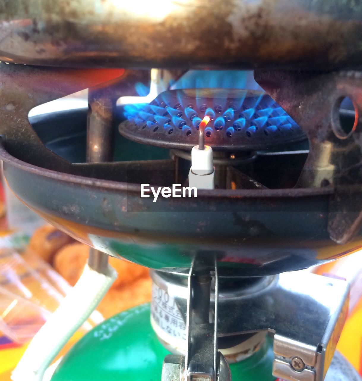 Close-up of cooking pan on burning camping stove