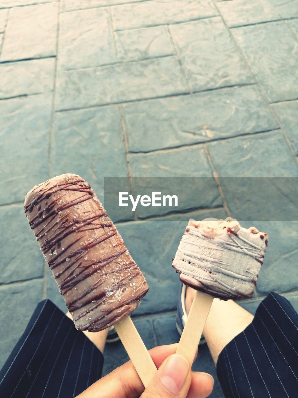 Close-up of hand holding ice cream cone