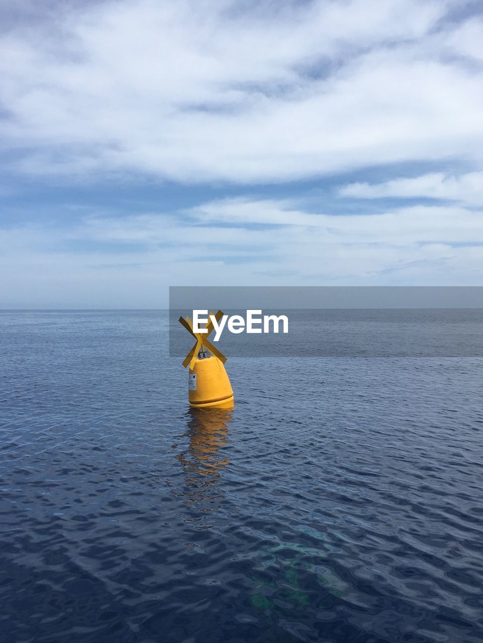 BOAT FLOATING ON SEA AGAINST SKY