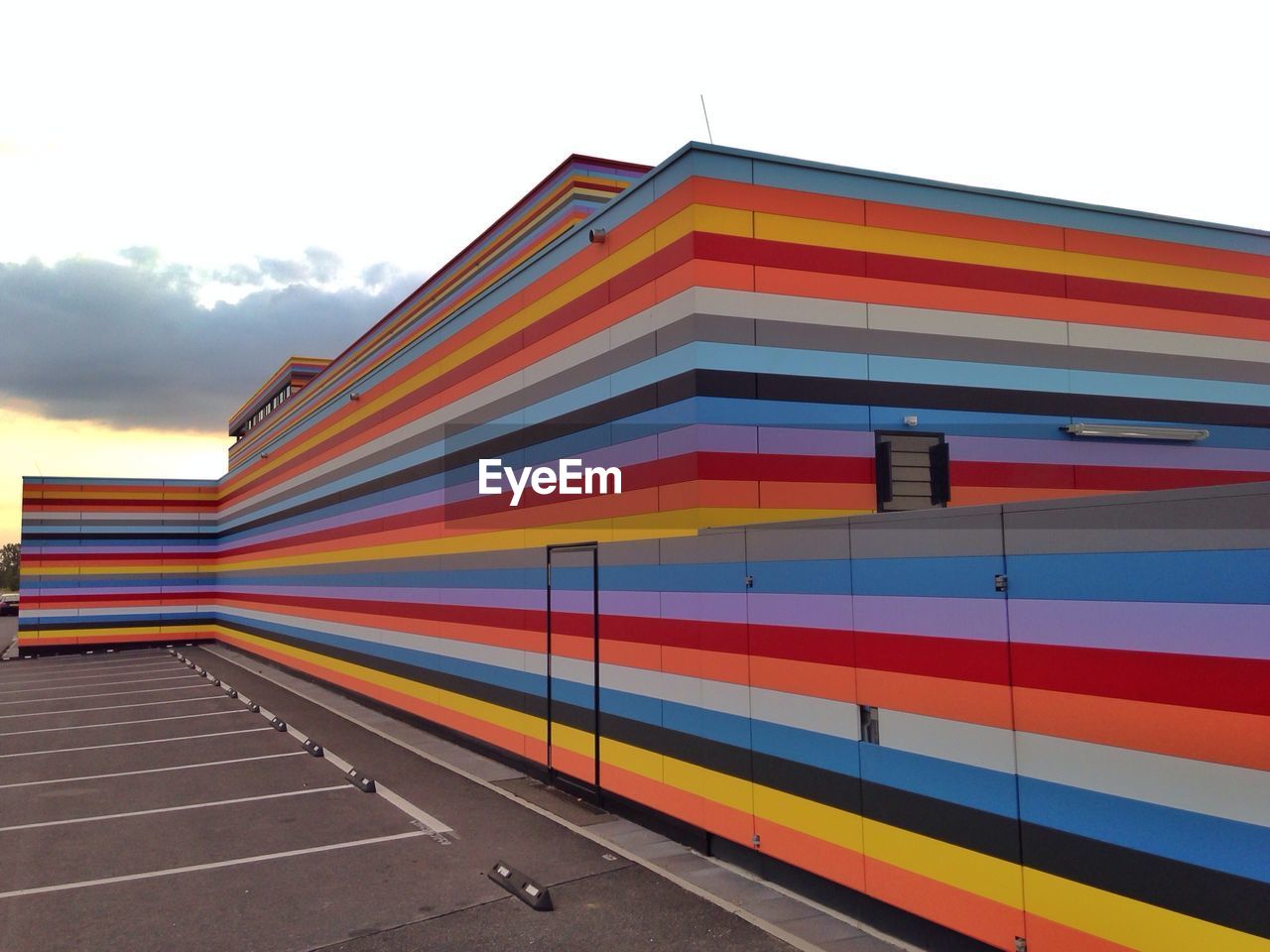 View of multi colored meininger hotel berlin airport against sky